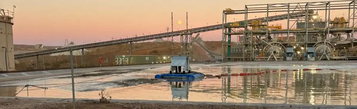 Dredge at Lithium Mine WA Dredging a plastic lined process pond at a Lithium mine in WA